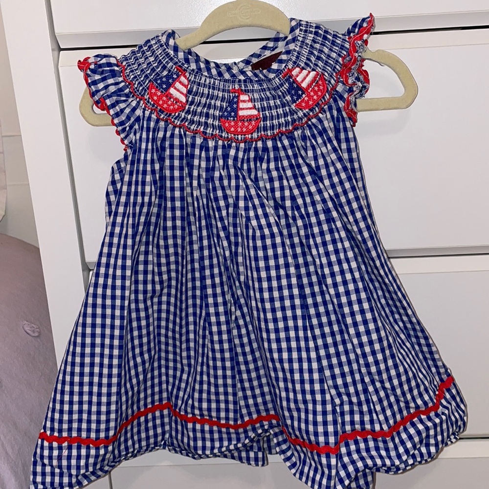 Lil Cactus. Blue smock American flag boats on collar.